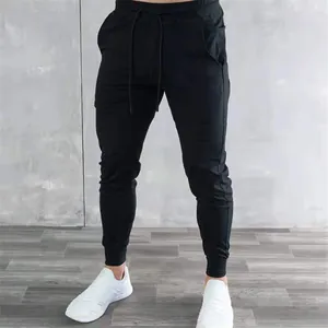 Detail of men's black slim fit athletic joggers with drawstring waist and pockets