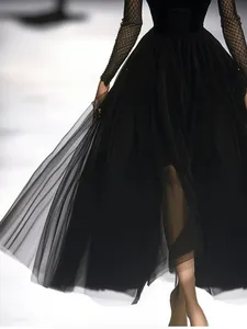 Elegant vintage French style black tulle maxi dress with mesh sleeves detail shown