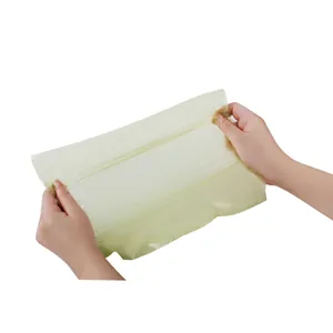 Detailed macro shot showing the high elasticity and strength of the yellow pet waste bag
