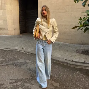Elegant cream jacquard jacket for women with vintage buttons in a street style look.