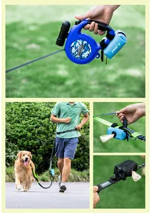 Close-up of portable pet waste bag dispenser attached to a retractable dog leash