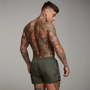 Back view of men's olive green mesh sports shorts with zipper pocket for gym
