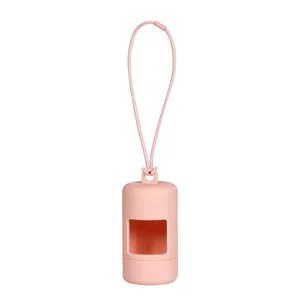 Macro view of a soft pink silicone dog poop bag dispenser with a portable strap