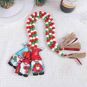 Festive Christmas wooden bead garland with three gnome pendants and jute tassels