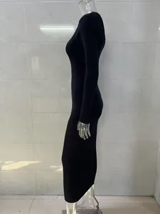 Side view showing details of elegant black ribbed knit long sleeve bodycon midi dress