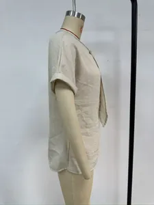 Detailed side view of a beige summer short-sleeved casual shirt on a mannequin stand