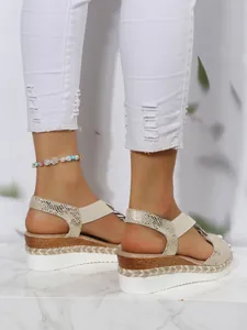 Stylish women's peep toe wedge sandals with snakeskin pattern and espadrille trim