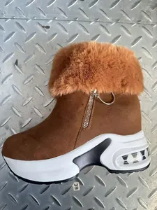 Brown fur-lined wedge platform snow boots with zipper detail for women