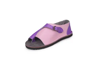 Detailed shot of women's leather flat sandals with pink and purple color block style