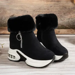 Detailed view of black winter snow boots with soft faux fur collar and platform sole