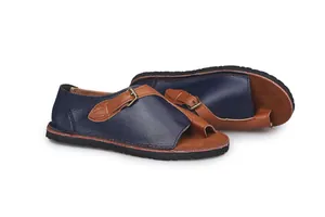 Detail view of vintage blue and brown color block leather flat sandals with toe ring