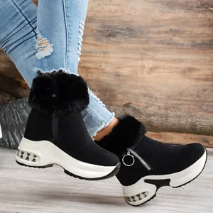 Detailed view of black faux fur platform snow boots with a stylish air cushion sole.