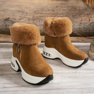 Detailed view of brown suede winter snow boots with plush faux fur collar and platform sole.