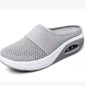 Side view of grey breathable mesh mules featuring air cushion sole and wedge platform