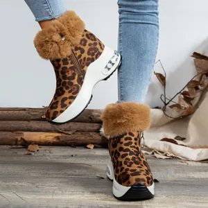 Side view of leopard print snow boots with plush fur trim and platform air cushion sole