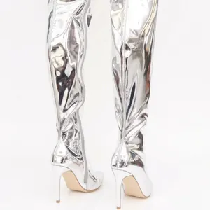 Silver metallic mirror over-the-knee boots with pointed toe and stiletto heel design