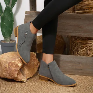 Grey pointed toe ankle boots with chunky heel and side zipper detail for winter