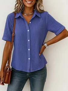 Detailed view of women's blue pure cotton crinkle shirt featuring casual button-down style