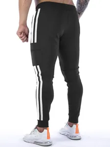 Detail view of men's black sports joggers with white stripes and a side cargo pocket.