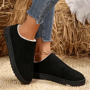Women's warm black fleece-lined snow slippers with suede finish and slip-on flat sole.