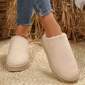 Chic women's beige flat snow boots featuring warm faux fur lining and slip-on design
