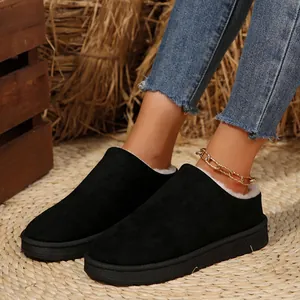 Cozy black suede winter slippers with warm white faux fur lining for women's home wear