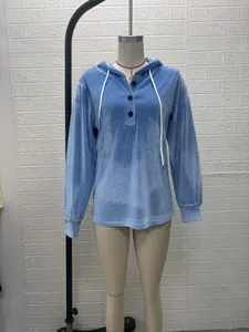 Blue velvet long-sleeved hooded sweatshirt with white drawstring on mannequin