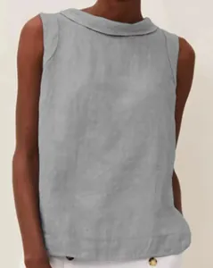 Close-up of grey sleeveless cotton-linen top with boat neck and textured fabric.