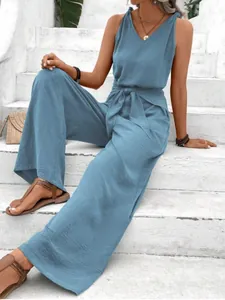 Stylish blue V-neck sleeveless wide-leg jumpsuit with waist tie detail for summer wear