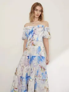 Elegant off-the-shoulder organza floral maxi dress featuring tiered ruffles and ethereal design