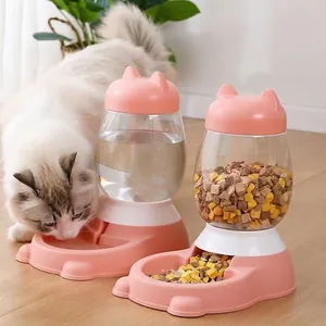 Detail view of pink cat automatic feeder and waterer set with white cat eating food
