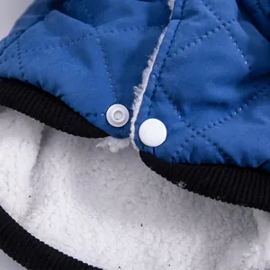 Blue quilted pet dog vest with warm fleece lining and white snap buttons detail.