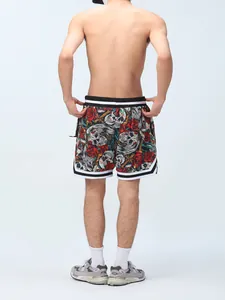 Back view of men's sports shorts featuring a unique floral and skull pattern with lining