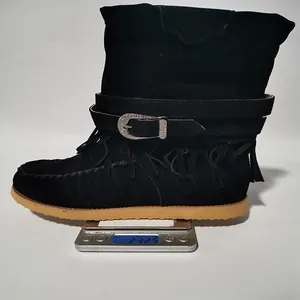 Black suede fringe boots weight measurement showing 232.5g on a scale
