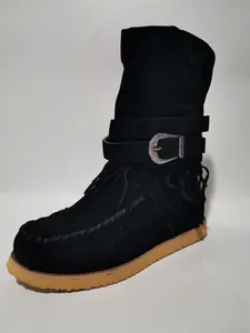 Detailed side view of black suede-like women's boots with tassels and silver buckle