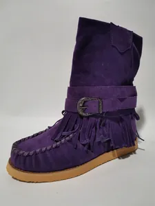 Detailed side profile of purple suede fringe boots with a decorative western metal buckle