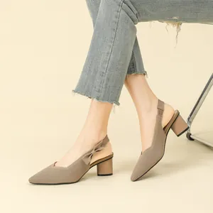 Elegant pointed-toe slingback heels with a thick block heel and side bow detail.