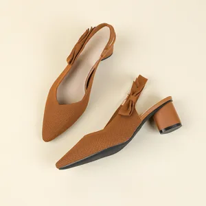 Elegant brown pointed-toe slingback pumps with bow detail and stylish chunky block heels