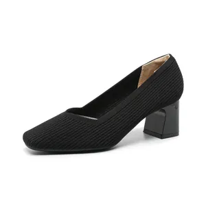 Elegant black block heel pumps for women featuring a chic square toe and ribbed fabric finish