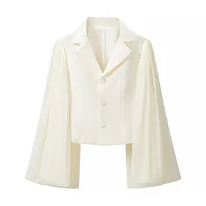 Elegant white cropped blazer with dramatic pleated flare sleeves and button closure
