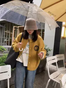 Korean style yellow knitted cardigan featuring a cute smiley face embroidery detail