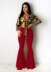 Sexy high-waisted red flare pants paired with a baroque floral tie-front crop top