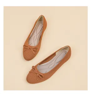 Top-down detailed view of women's ribbed knit ballet flats with a classic bow.