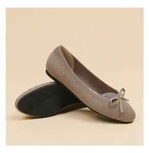 Detail of round-toe ballet flats with ribbed texture and dainty bow ornament