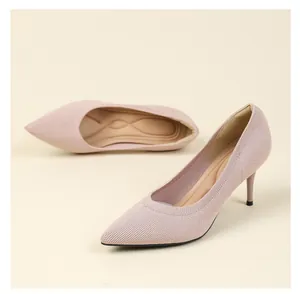 Close-up view of pink knitted pointed-toe high heel pumps with elegant stiletto heels.