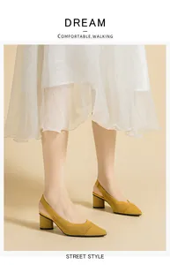 Detailed view of yellow knitted slingback block heel sandals with pointed toe design