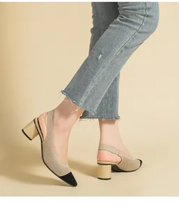 Elegant beige and black knit slingback pumps with a comfortable chunky block heel.