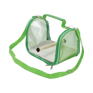 Detail view of a green portable bird carrier bag featuring breathable mesh and wooden perch