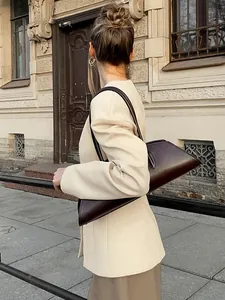 Stijlvolle abrikooskleurige getailleerde blazer met V-hals voor dames en structuur