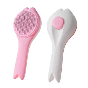 Pink and white stainless steel self-cleaning pet grooming brush for cats and dogs